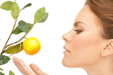 Image showing lovely woman with lemon twig