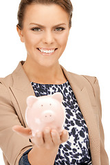 Image showing lovely woman with piggy bank