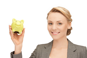 Image showing lovely woman with piggy bank