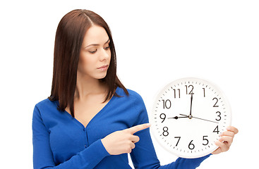 Image showing woman holding big clock