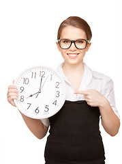 Image showing woman holding big clock