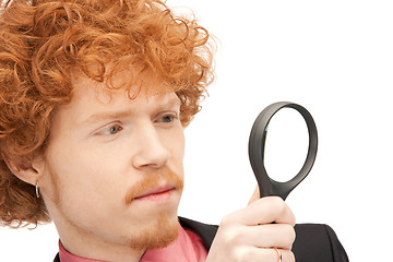 Image showing man with magnifying glass