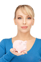 Image showing lovely woman with piggy bank