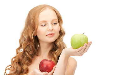 Image showing young beautiful woman with green and red apples