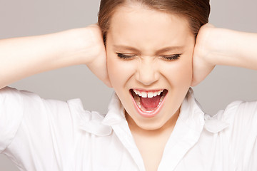 Image showing woman with hands on ears