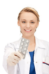 Image showing attractive female doctor with pills