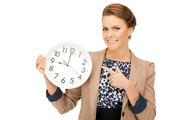 Image showing woman holding big clock