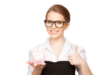 Image showing lovely woman with piggy bank