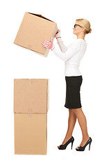 Image showing attractive businesswoman with big boxes