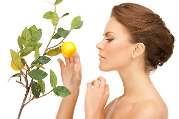 Image showing lovely woman with lemon twig