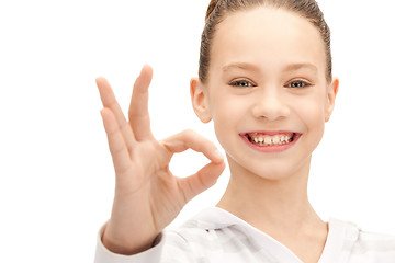 Image showing lovely teenage girl showing ok sign