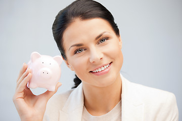 Image showing lovely woman with piggy bank