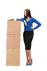 Image showing attractive businesswoman with big boxes