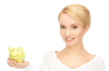 Image showing lovely woman with piggy bank