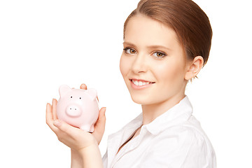 Image showing lovely woman with piggy bank