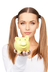 Image showing lovely woman with piggy bank