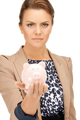 Image showing lovely woman with piggy bank