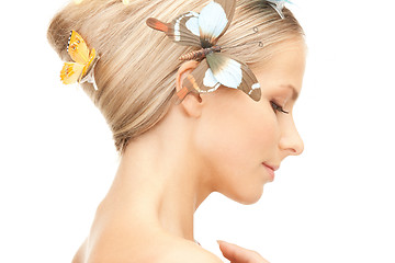 Image showing beautiful woman with butterfly in hair