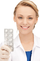 Image showing attractive female doctor with pills