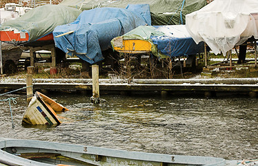 Image showing little boat going down