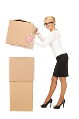 Image showing attractive businesswoman with big boxes