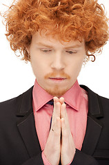 Image showing praying businessman