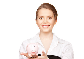 Image showing lovely woman with piggy bank