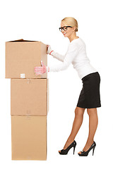 Image showing attractive businesswoman with big boxes