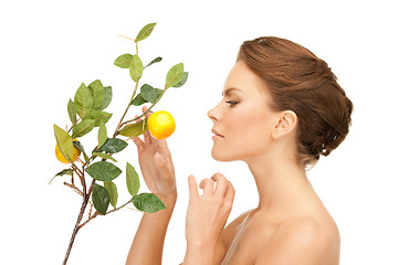 Image showing lovely woman with lemon twig