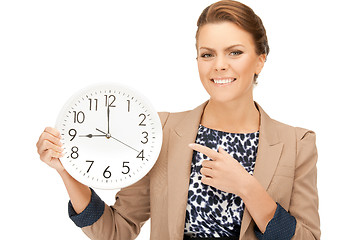 Image showing woman holding big clock