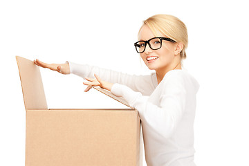 Image showing attractive businesswoman with cardboard box