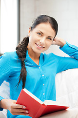 Image showing happy and smiling woman with book