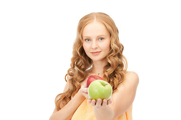 Image showing young beautiful woman with green and red apples