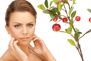 Image showing lovely woman with apple twig