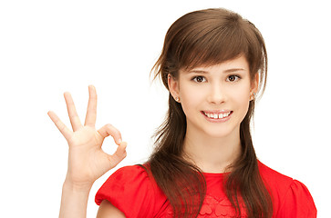 Image showing lovely teenage girl showing ok sign