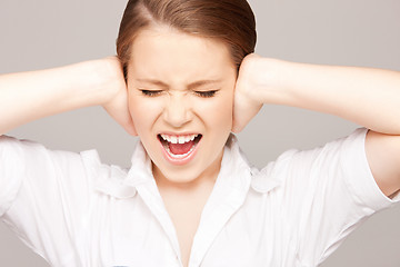 Image showing woman with hands on ears