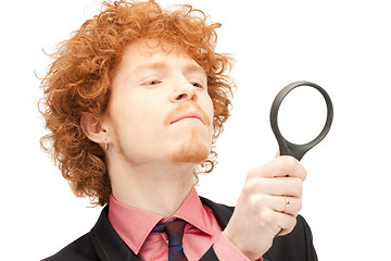 Image showing man with magnifying glass