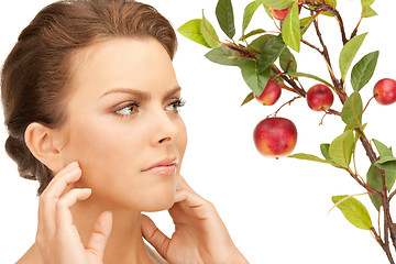 Image showing lovely woman with apple twig