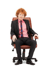 Image showing young businessman sitting in chair