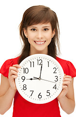 Image showing teenage girl holding big clock