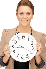 Image showing woman holding big clock