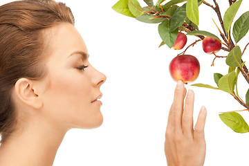 Image showing lovely woman with apple twig