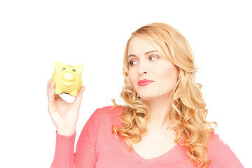 Image showing lovely woman with piggy bank