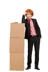 Image showing attractive businessman with big boxes