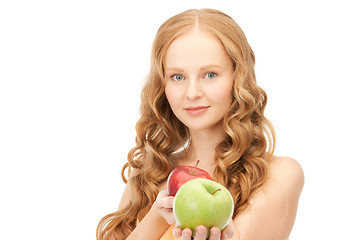 Image showing young beautiful woman with green and red apples