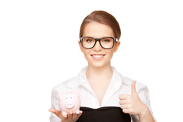 Image showing lovely woman with piggy bank