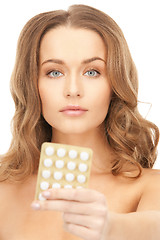 Image showing young beautiful woman with pills 