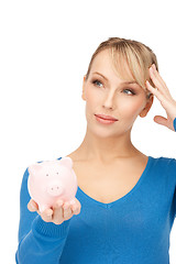 Image showing lovely woman with piggy bank