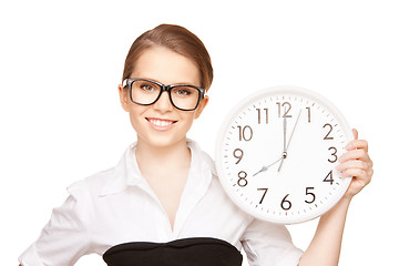 Image showing woman holding big clock