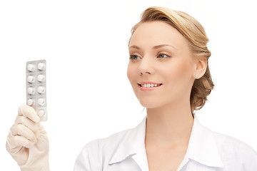 Image showing attractive female doctor with pills